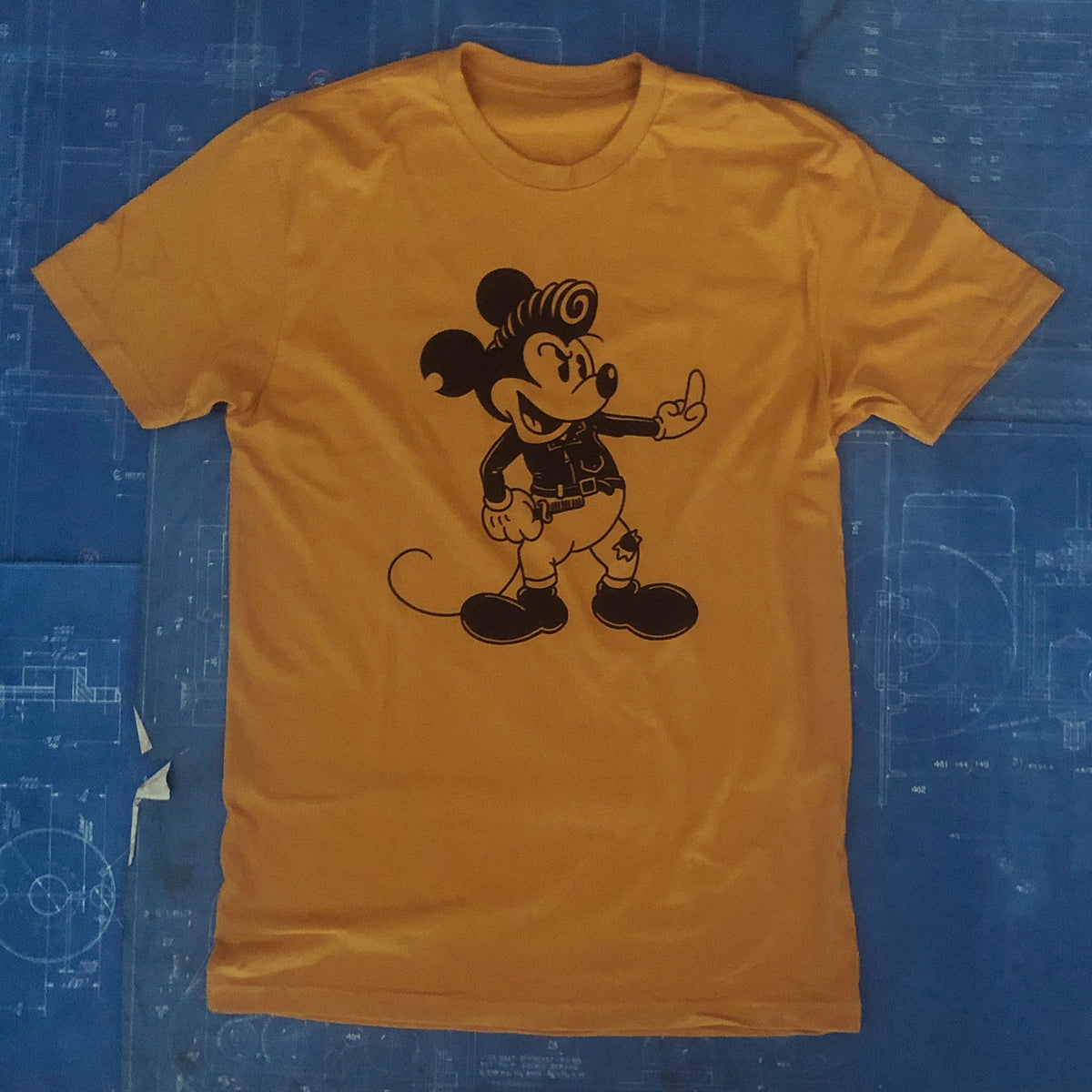 A "GREASER MICK" TSY TEE T-SHIRT, OLD GOLD